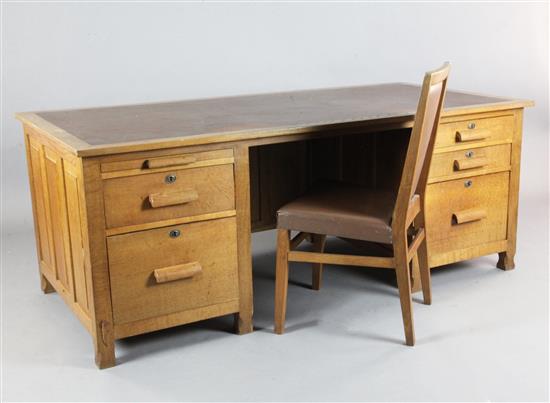Derek Lizardman Slater. An early 20th century oak desk, W.6ft D.3ft H.2ft 4in., together with a matching desk chair